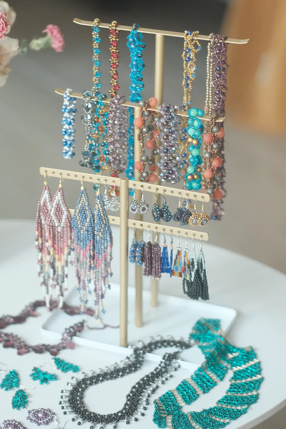 A display stand of beaded earrings and necklaces